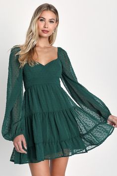 You're certain to fall for the Lulus Longing And Love Emerald Swiss Dot Puff Long Sleeve Mini Dressâ€”and once you've got it, everyone else will be falling for you! Lightweight woven fabric, embellished with Swiss dots, forms a bustier-inspired bodice with a sweetheart neckline and sheer balloon sleeves with elastic at the shoulders and cuffs. A high set-in waist tops the two-tiered mini skirt, falling to a ruffled hem. Double ties across the open back give this dress a flirty and fun finish. Hi Christmas Dress For Teens, Puff Long Sleeves, Grad Dresses, Hoco Dresses, Dresses For Teens