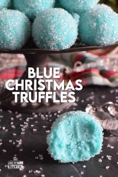 blue christmas truffles on a table with snow flakes