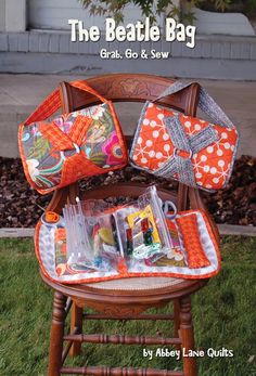 an old chair with some items in it and the words, the beatle bag grab, do & sew