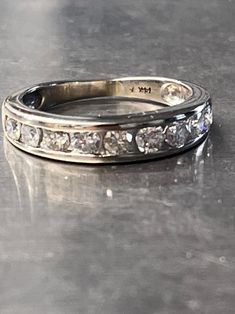 a close up of a wedding ring on a table