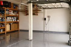 the inside of a garage with shelves and tools