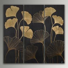 three panels with gold leaf designs on them