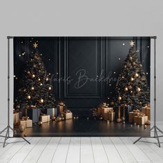 a black and gold christmas tree backdrop with presents on the floor in front of it