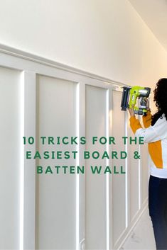 a woman using a driller on the wall with text overlay reading 10 tricks for the easier board & batten wall