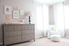 a baby's room with a crib and dresser