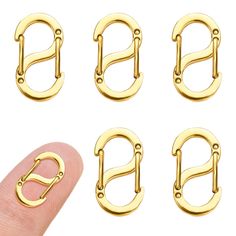 four pairs of gold plated metal alphabets with the letter q on each side