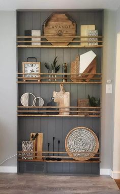 the shelves in this living room are filled with decorative items