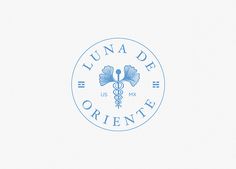 a blue and white logo with the words lunaa de orientte in it's center