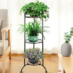 three tiered plant stand with potted plants