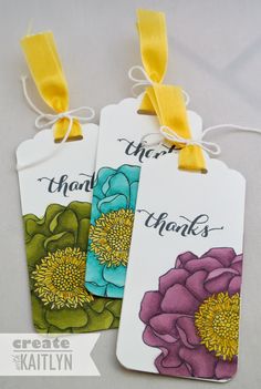 two tags with flowers on them that say thank