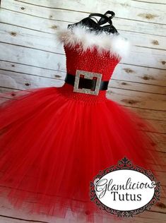 a red and white tutule dress with a santa clause on it's chest