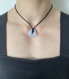 Freshen up your spring summer look with this light blue flower pendant necklace! Completely versatile necklace that you can wear short or long. Can go with any style of outfit and would look great as part of a necklace stack. Would make a great gift for family, friends, or yourself. All of my necklaces are handmade with care. I offer free shipping on all of my items and normally ship Monday, Wednesday, and Friday. Adjustable from about 16 inches to approx 27 inches Baby blue flower resin pendant measures 25 mm/ 0.98 inches by 25 mm/0.98 inches y2k pendant necklace, cord necklace, black cord necklace, pendant necklace, cord necklace with pendant, black cord necklace with pendant, y2k necklace, black cord necklace, chunky necklace, black string necklace, y2k jewellery, rope necklace, cord pe Necklace Y2k, Necklace Stack, Y2k Necklace, Y2k Jewelry, Light Blue Flowers, Necklace Cord, Flower Resin, Flower Pendant Necklace, Rope Necklace