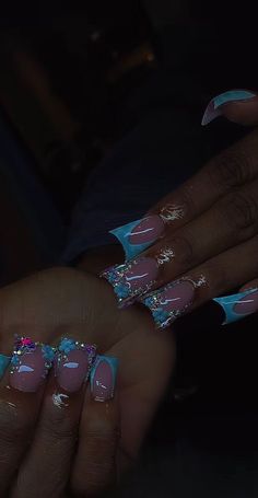 Short Light Blue Nails With Rhinestones, Blue Acrylic Nails With Charms, Summer Junk Nails, Spring Junk Nails, Medium Junk Nails, Chrome Duck Nails, Tattoo Ideas Female Black Women, Short Blinged Out Nails, Dramatic Lash Extensions