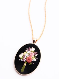 a necklace that has flowers on it