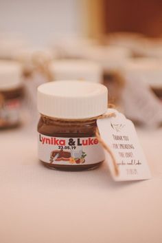 a jar of peanut butter sitting on top of a table next to a price tag