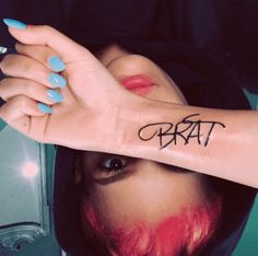 a woman's hand with the word craft tattooed on her left arm and wrist