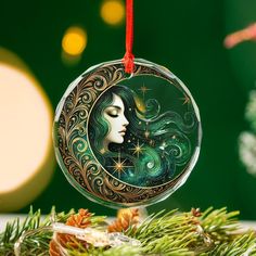 a glass ornament with a woman's face on it