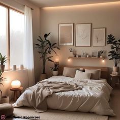 a bedroom with plants and pictures on the wall