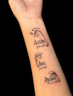 a wrist tattoo with footprints and names on it