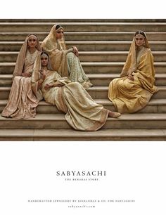 three women sitting on the steps in sariyasachi's latest advert