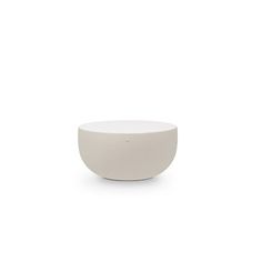 a white bowl sitting on top of a table