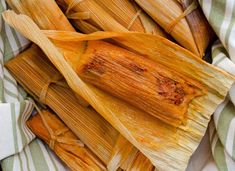 corn on the cob is sitting in a basket