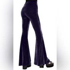 Your New Favourite Not-So-Basic! These Bell Bottoms Are Flattering Lines Of Soft, Stretch Velvet That Drape And Flatter The Figure. With A Secure, Wide Waistband These Babies Are Perfect To Pair With Crops And Heels, Ideal For Swishing Around The Dancefloor In. Wash Cold - Gentle Cycle Material: 95% Cotton, 5% Elastane. Purple Full-length Bottoms For Night Out, Chic Fitted Bottoms For Festival, Fitted Flare Purple Bottoms, Purple Fitted Flare Bottoms, Purple Disco Bottoms, Fitted Purple Disco Bottoms, Chic Fitted Festival Pants, Trendy Purple Bottoms For Festival, Bell Bottom Jumpsuits