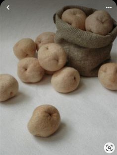 several small pieces of bread sitting next to a bag