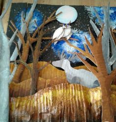 an art project with trees and birds in the night sky, made out of paper