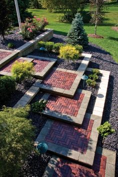 an aerial view of a brick pathway in a garden