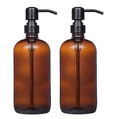 two brown soap dispensers sitting next to each other on a white background