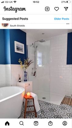 a bathroom with blue walls and white tile on the floor is featured in instagram