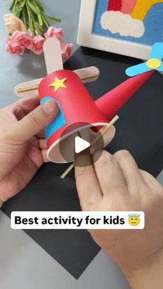 a person is making a paper airplane out of wood sticks and construction material with the words best activity for kids