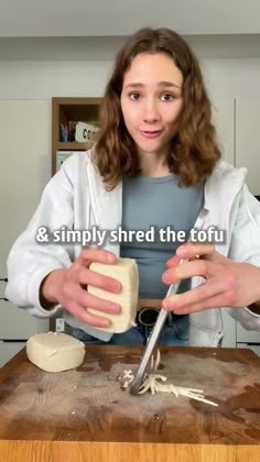 a woman is making bread on a wooden cutting board with the words, & simply shred the tofu