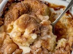 a close up of food on a plate with a spoon