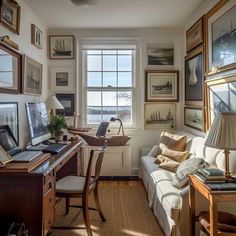 a living room filled with furniture and lots of pictures on the wall next to a window