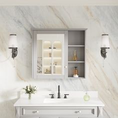 a bathroom with marble walls and white counter tops, two lights on either side of the sink