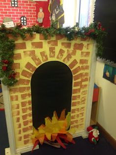 a fire place is decorated with christmas decorations