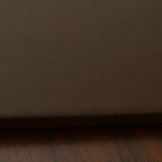 a laptop computer sitting on top of a wooden desk