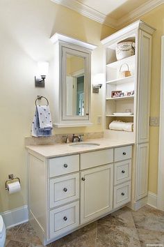 a bathroom with a sink, mirror and toilet in it's corner next to a walk - in closet