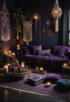 a living room filled with purple couches and candles