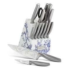 a set of knives sitting on top of a knife block