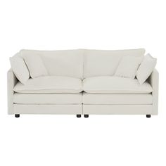 a white couch with pillows on it