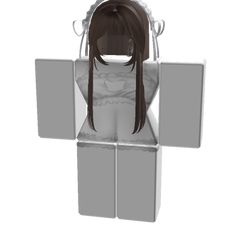 a woman with long hair is sitting in a cube