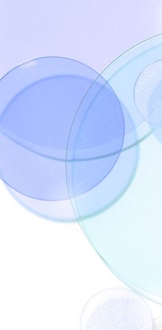 an image of three plates on a white tablecloth with blue circles around them and one plate in the middle