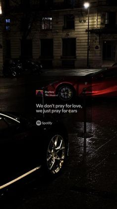 a car parked on the side of a road in front of a building with a sign that says we don't pray for love