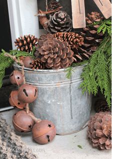 some pine cones are sitting in a bucket