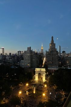 the city skyline is lit up at night