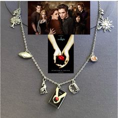 the twilight saga movie poster is attached to a necklace with charms and an apple on it