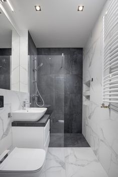 a modern bathroom with marble walls and flooring